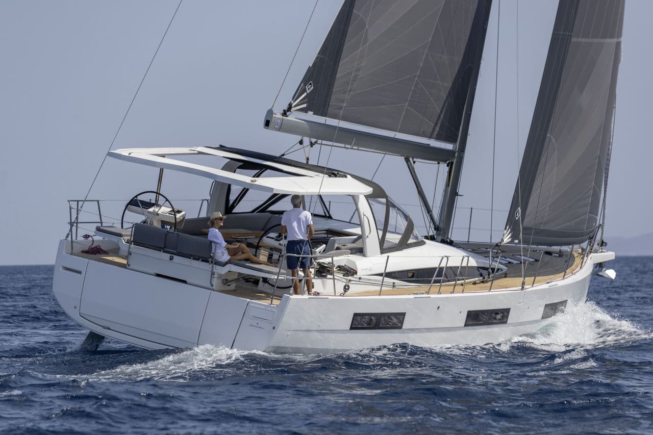 A Jeanneau Yachts 60 under sail, crew in the cockpit